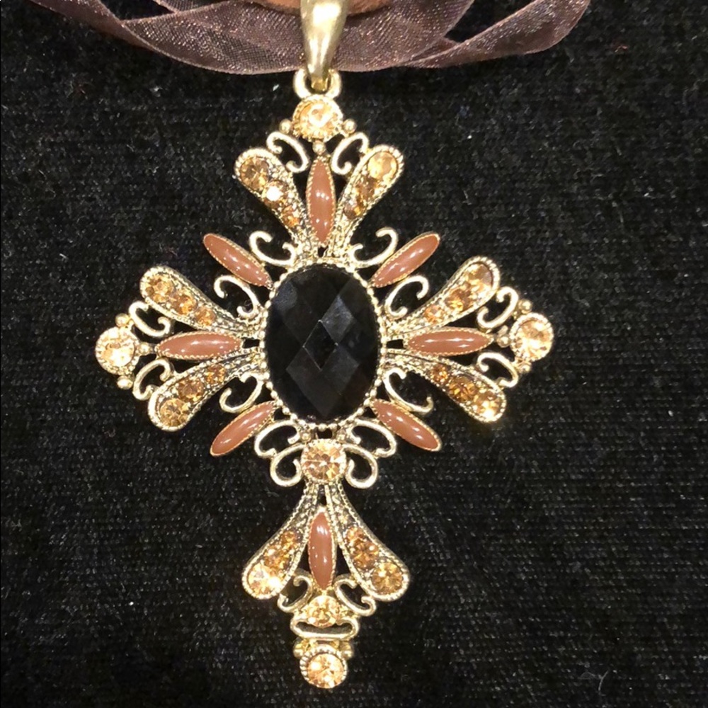 Good cross with brown crystals on organza ribbon.